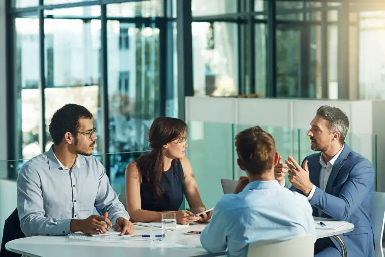 Professional services team meeting around a table