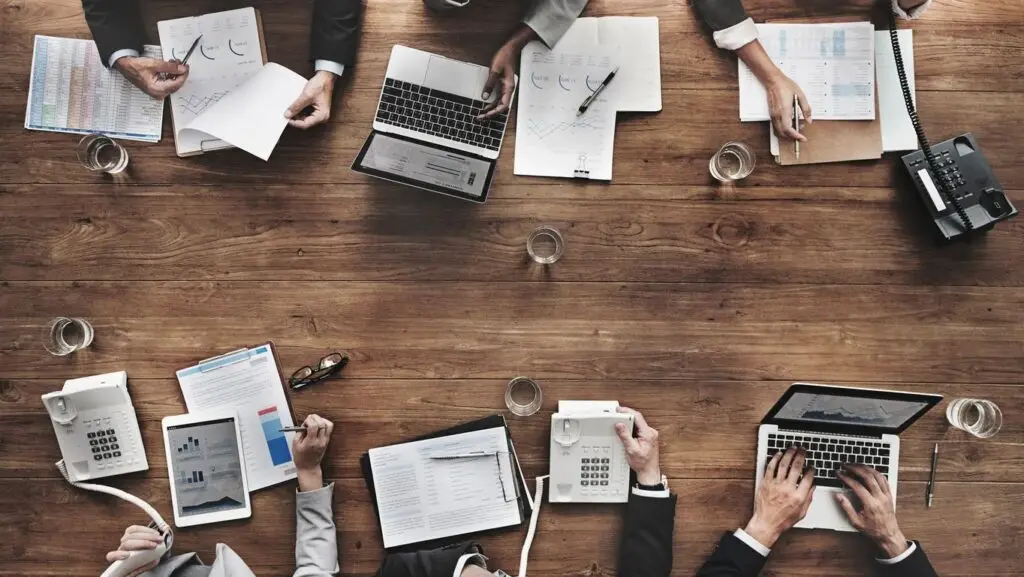 Professional services team reviewing client work together